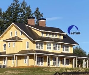 Large yellow house with brown metal roof